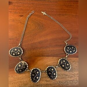 Is it Damascene is it Mod? very cool gold tone, and raised black symbols.